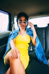 Portrait of woman sitting in car