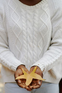 Close-up of woman holding umbrella