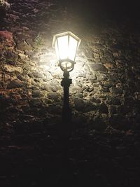 Low angle view of illuminated lamp post