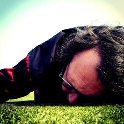 Close-up of man in grass