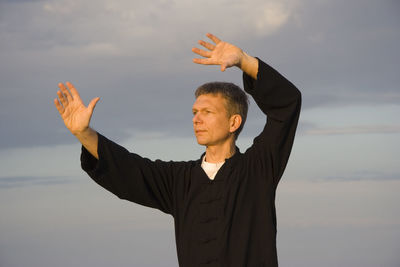 Close-up of a man doing tai chi