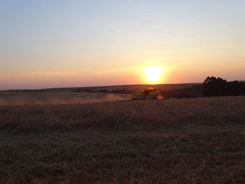 Scenic view of landscape against sky during sunset