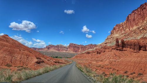 Panoramic view of road amidst mountains against sky