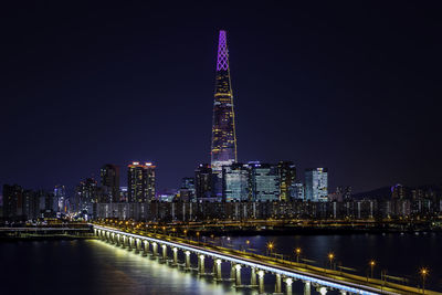 Illuminated buildings in city at night