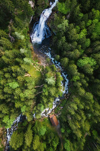 Aerial image of beautiful waterfalls near old mill in golling, salzburg, austria