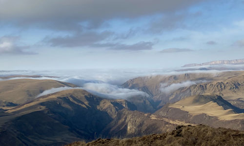 Scenic view of snowcapped mountains against sky