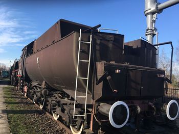 Train on railroad track against sky