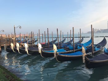 Boats moored in canal