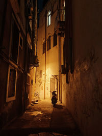 Rear view of man standing in abandoned building