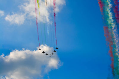 Low angle view of airshow in sky