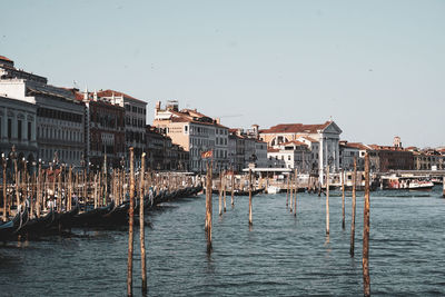 Boats in sea against clear sky