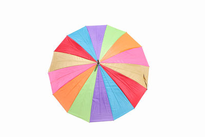 High angle view of multi colored umbrella against white background