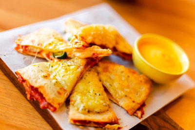 Close-up of snacks served on table