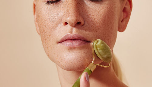 Close-up of woman holding plant