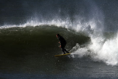 Man splashing water in sea