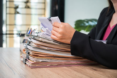 Midsection of person working on table