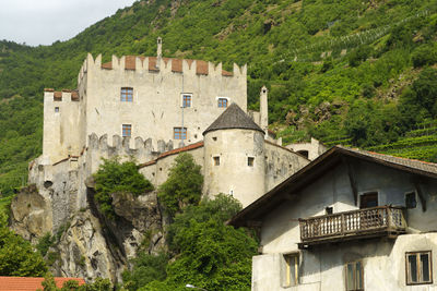 Buildings against mountain