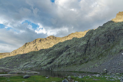 Scenic view of landscape and mountains against sky