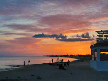 Scenic view of beach against sky during sunset