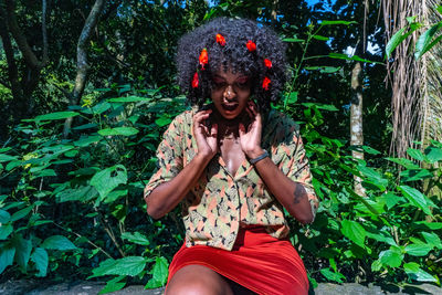 Portrait of woman sitting outdoors
