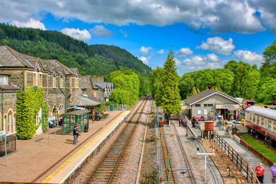 Train at railroad station against sky