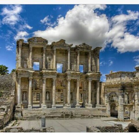 architecture, built structure, building exterior, history, sky, cloud - sky, old, the past, old ruin, ancient, low angle view, famous place, travel destinations, cloudy, cloud, religion, arch, architectural column, place of worship, ancient civilization