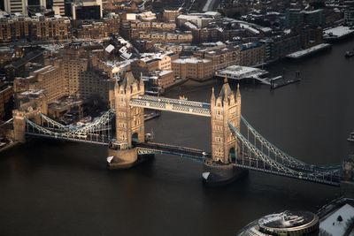 Aerial view of tower bridge over thames river in city