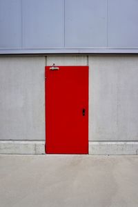 Red closed door of building