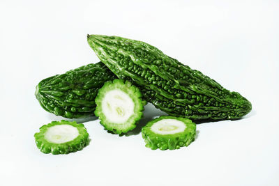 Close-up of green pepper against white background