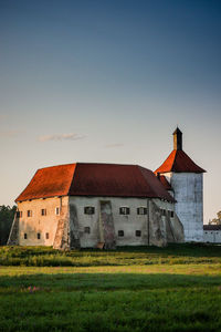 House on field against sky