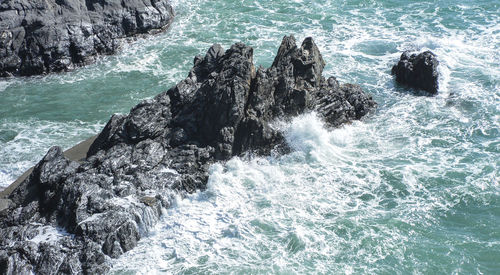 Sea waves splashing on rocks