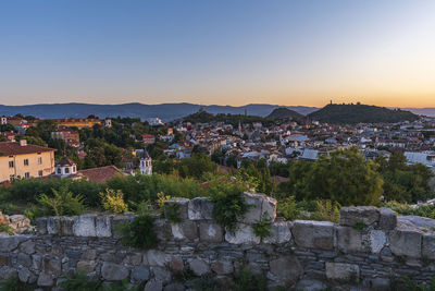 View of townscape against sky at sunset