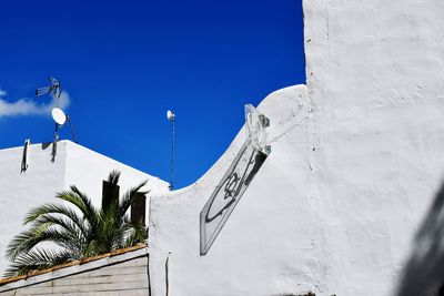 Low angle view of building against blue sky