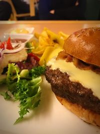 Close-up of burger in plate on table