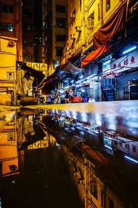 Illuminated city street at night