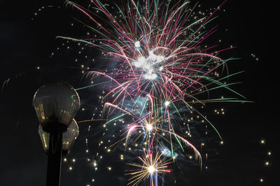 Firework display at night