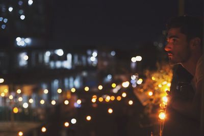 Defocused image of illuminated city at night