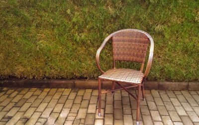 Empty chair against grass