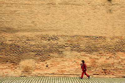 Woman walking on a wall