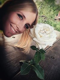 Portrait of woman holding flower