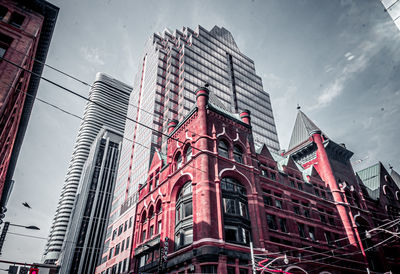 Low angle view of modern buildings against sky