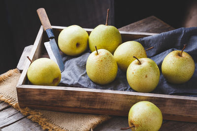 Close-up of fruits on wooden table