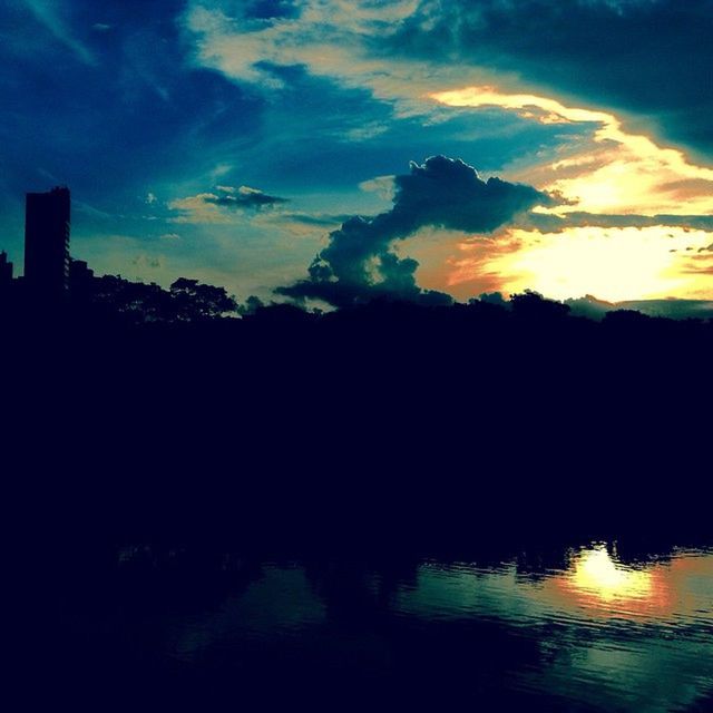 sunset, silhouette, water, sky, scenics, tranquil scene, beauty in nature, tranquility, waterfront, cloud - sky, reflection, nature, idyllic, dusk, orange color, lake, cloud, sea, dramatic sky, tree