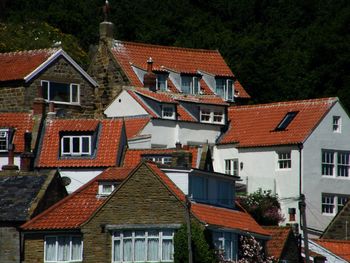 Houses against sky in city