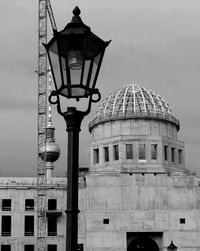 Low angle view of communications tower against sky