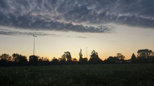 Scenic view of field against sky during sunset