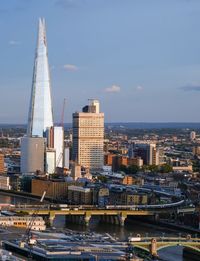 Modern buildings in city against sky