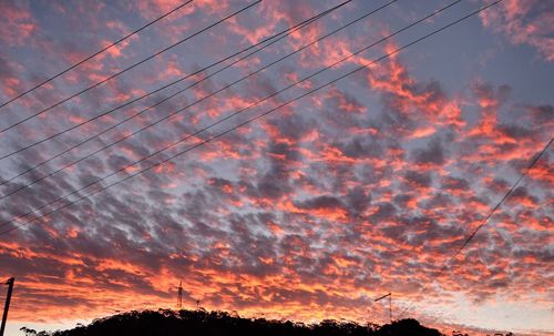 Low angle view of dramatic sky during sunset