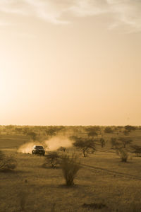 Scenic view of car driving through sahara desert mali