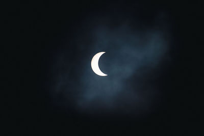 Low angle view of half moon in sky